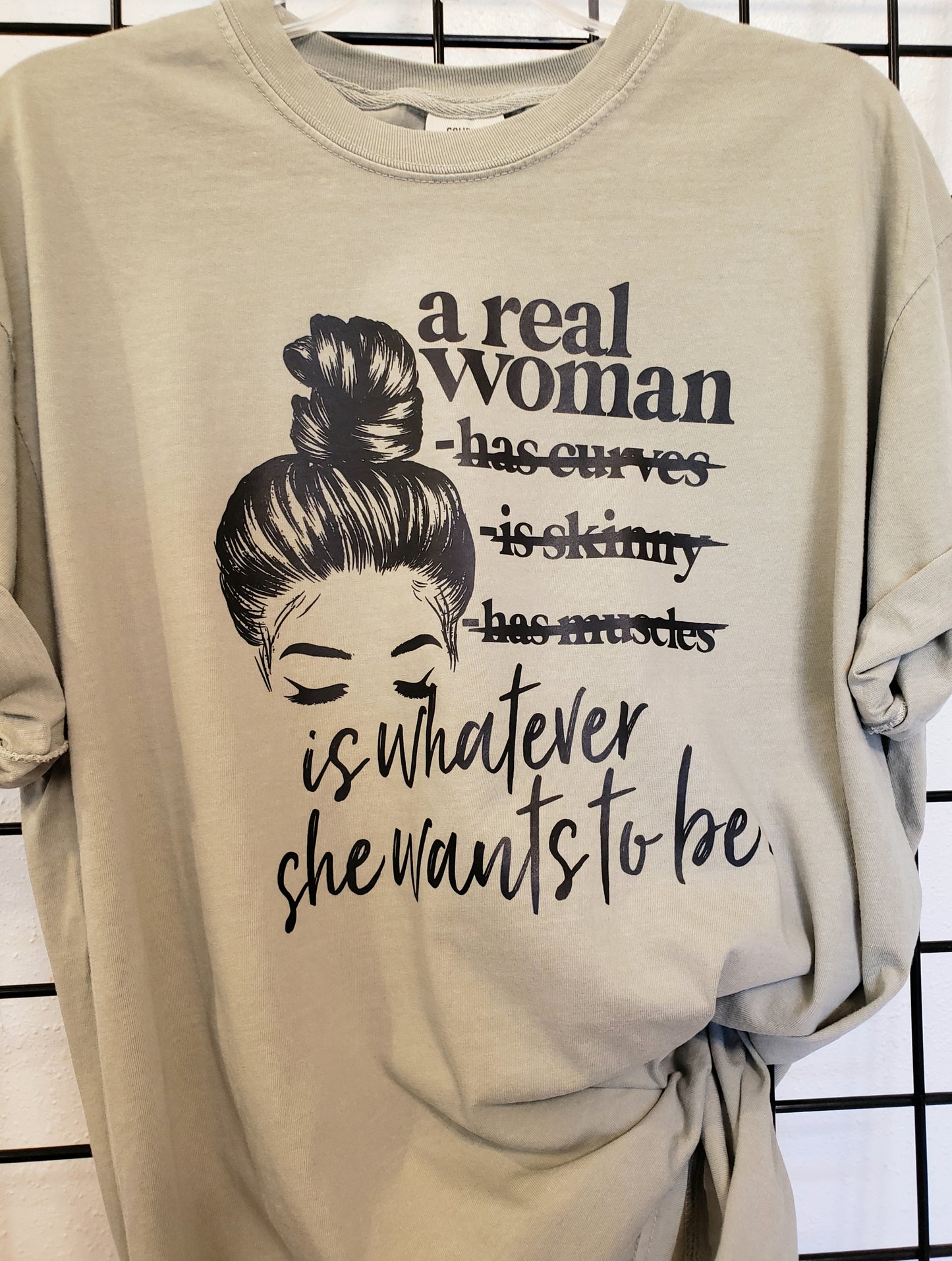 A Real Woman Comfort Colors Sandstone Unisex Tshirt